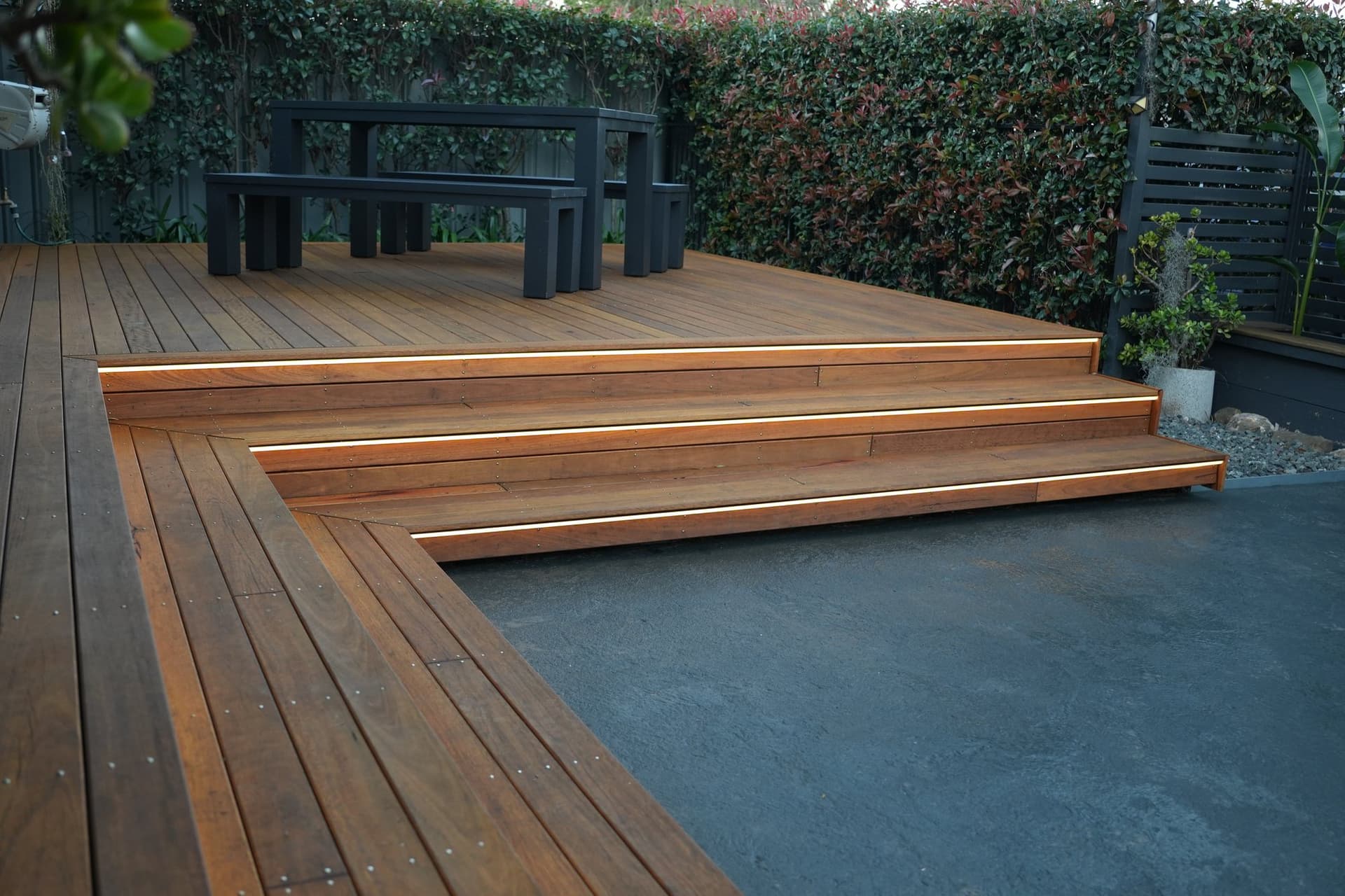 Hardwood deck with mitred steps across the full backyard