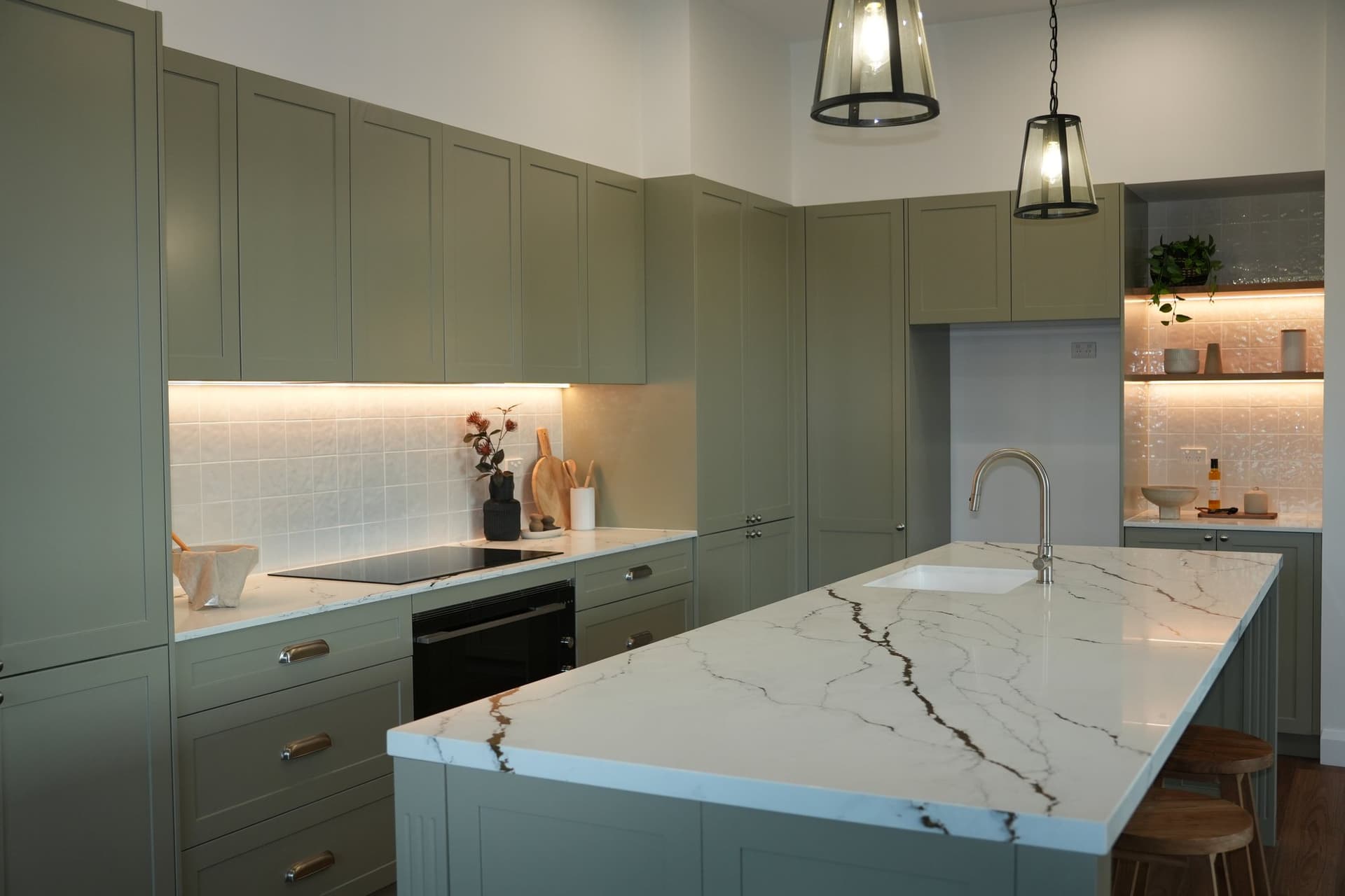 Kitchen fit-out with stone island and custom cabinetry by JTR Built